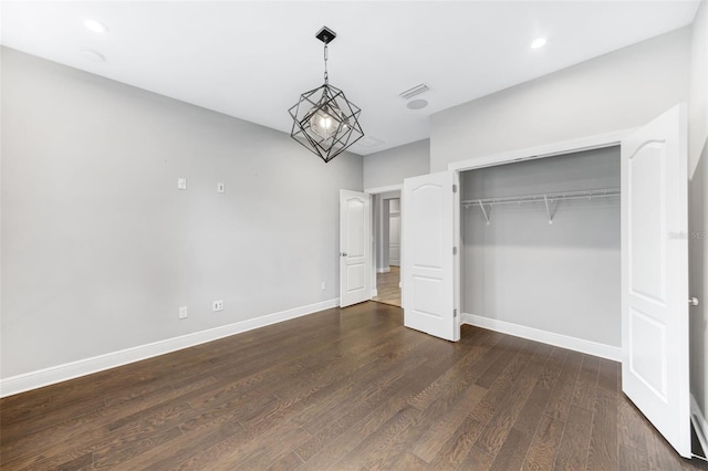 5434 Silver Sun Dr, Apollo Beach, FL 33572 - unfurnished bedroom featuring dark wood-type flooring, a closet, and recessed lighting