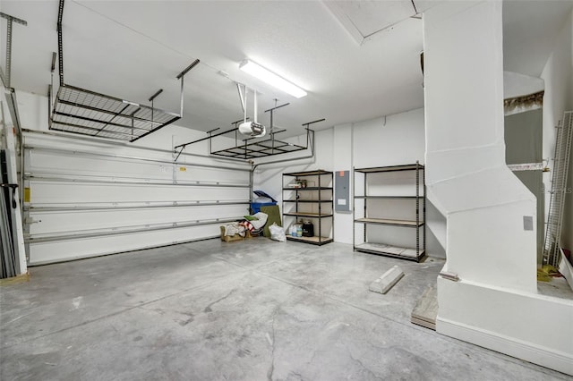 5434 Silver Sun Dr, Apollo Beach, FL 33572 - garage featuring a garage door opener and electric panel