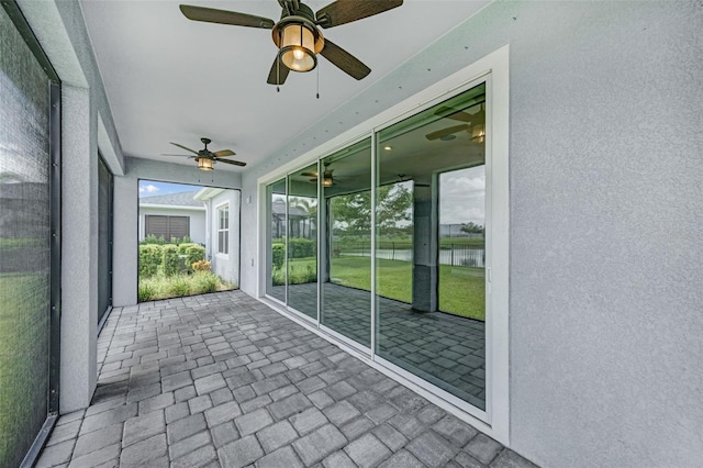 5434 Silver Sun Dr, Apollo Beach, FL 33572 - unfurnished sunroom with a ceiling fan and a water view