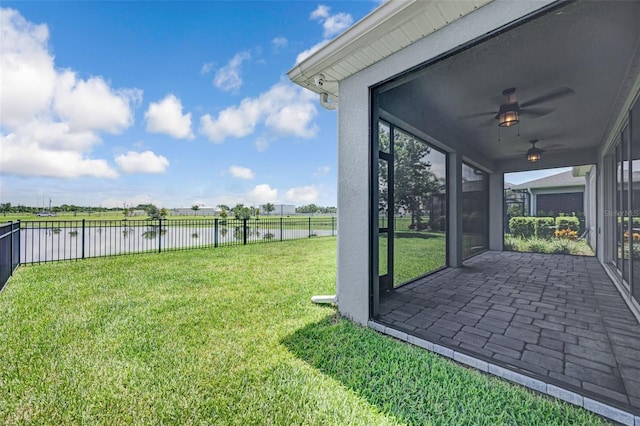 5434 Silver Sun Dr, Apollo Beach, FL 33572 - fenced backyard with a water view, a ceiling fan, and a patio
