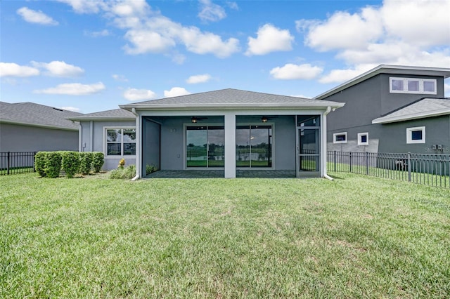 5434 Silver Sun Dr, Apollo Beach, FL 33572 - rear view of property featuring a fenced backyard, ceiling fan, a sunroom, and stucco siding