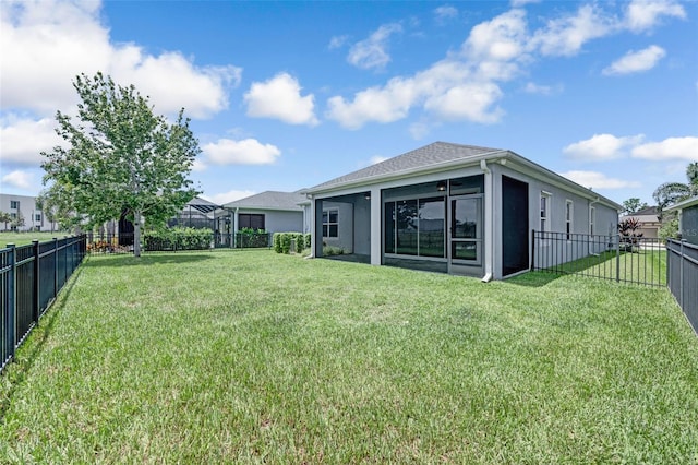 5434 Silver Sun Dr, Apollo Beach, FL 33572 - fenced backyard with a sunroom