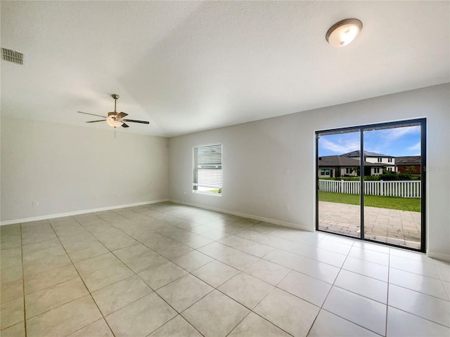 13008 Majestic Garden Ln, Riverview, FL 33579 - spare room with light tile patterned floors and ceiling fan