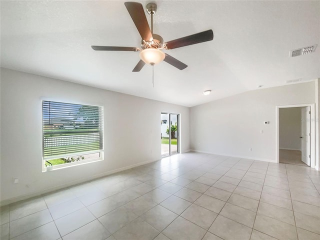 13008 Majestic Garden Ln, Riverview, FL 33579 - unfurnished room with vaulted ceiling, light tile patterned floors, and ceiling fan