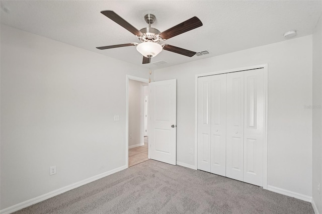 13008 Majestic Garden Ln, Riverview, FL 33579 - unfurnished bedroom featuring carpet floors, a closet, and a ceiling fan