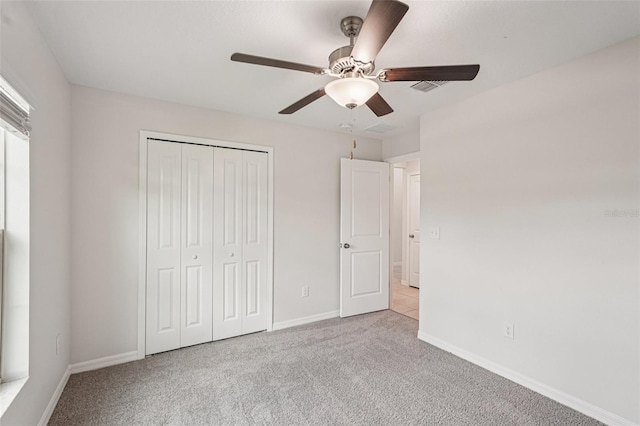 13008 Majestic Garden Ln, Riverview, FL 33579 - unfurnished bedroom with carpet, a closet, and a ceiling fan