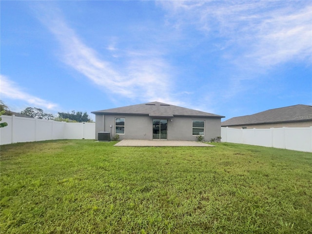 13008 Majestic Garden Ln, Riverview, FL 33579 - back of property featuring a patio, stucco siding, and a fenced backyard