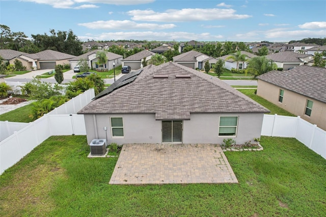 13008 Majestic Garden Ln, Riverview, FL 33579 - rear view of house featuring roof with shingles, a residential view, a patio, stucco siding, and a fenced backyard