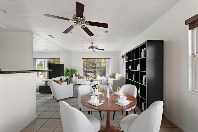 3753 46th Ave S Unit 10, Saint Petersburg, FL 33711 - dining room featuring light tile patterned floors and ceiling fan