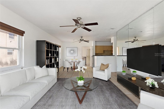 3753 46th Ave S Unit 10, Saint Petersburg, FL 33711 - living room featuring light tile patterned flooring and a ceiling fan