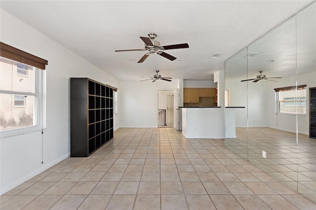 3753 46th Ave S Unit 10, Saint Petersburg, FL 33711 - unfurnished living room with a ceiling fan and light tile patterned floors