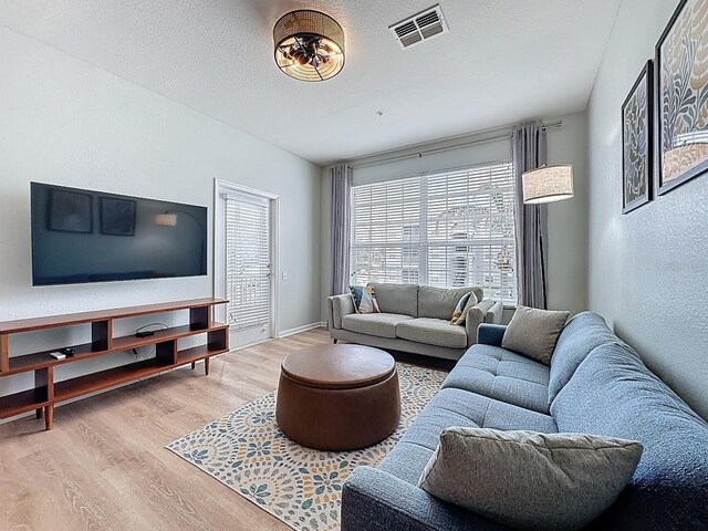 2300 Butterfly Palm Way Unit 204, Kissimmee, FL 34747 - living area with wood finished floors