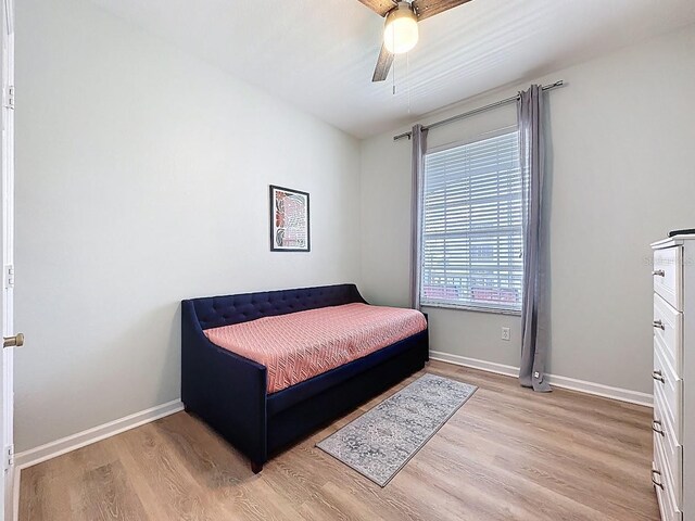 2300 Butterfly Palm Way Unit 204, Kissimmee, FL 34747 - bedroom with light wood finished floors and a ceiling fan