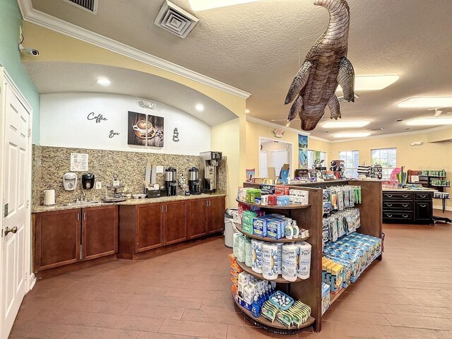 2300 Butterfly Palm Way Unit 204, Kissimmee, FL 34747 - misc room featuring crown molding and light wood-type flooring