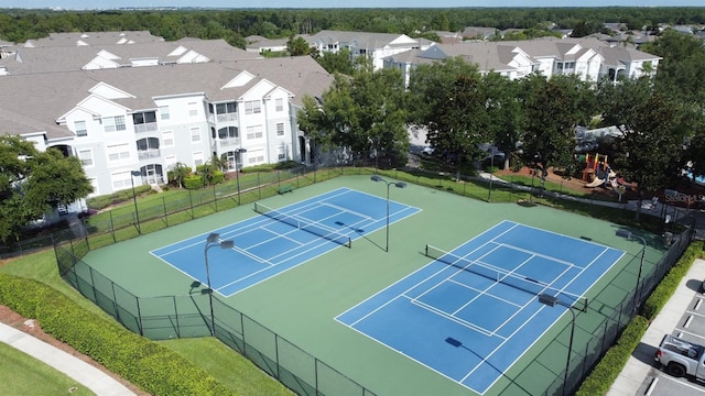 2300 Butterfly Palm Way Unit 204, Kissimmee, FL 34747 - view of tennis court featuring a residential view