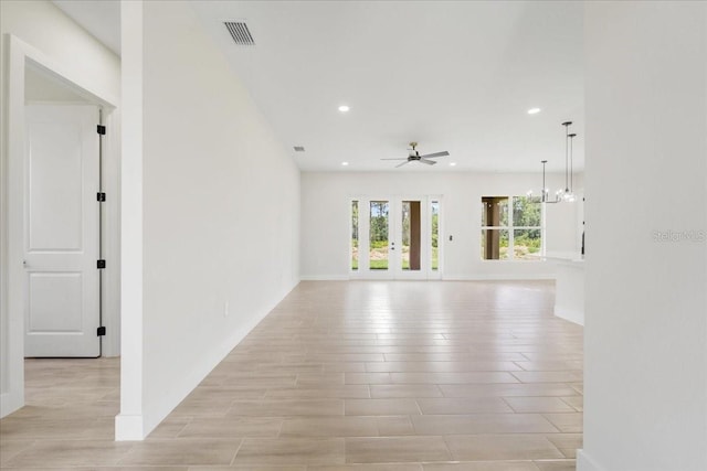 437 Mercedes Ct, Lehigh Acres, FL 33972 - empty room with a ceiling fan, recessed lighting, and light wood-style flooring