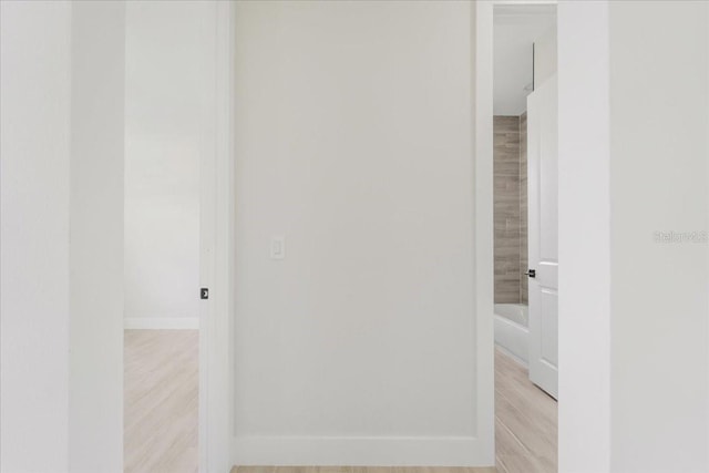 437 Mercedes Ct, Lehigh Acres, FL 33972 - corridor with light wood-style flooring and baseboards