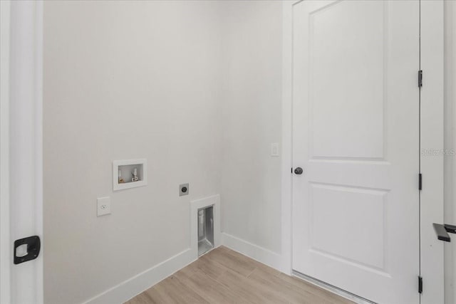 437 Mercedes Ct, Lehigh Acres, FL 33972 - laundry area featuring hookup for an electric dryer, washer hookup, and light wood-style floors