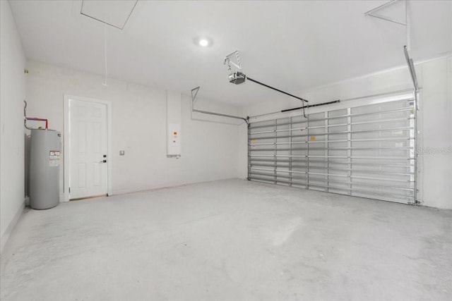 437 Mercedes Ct, Lehigh Acres, FL 33972 - garage with electric water heater and a garage door opener