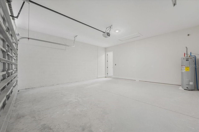 437 Mercedes Ct, Lehigh Acres, FL 33972 - garage with water heater and a garage door opener
