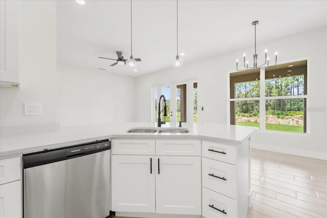 437 Mercedes Ct, Lehigh Acres, FL 33972 - kitchen featuring dishwasher, plenty of natural light, a peninsula, white cabinetry, and recessed lighting