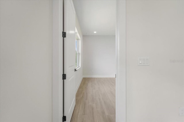 437 Mercedes Ct, Lehigh Acres, FL 33972 - hallway with light wood-style floors and recessed lighting