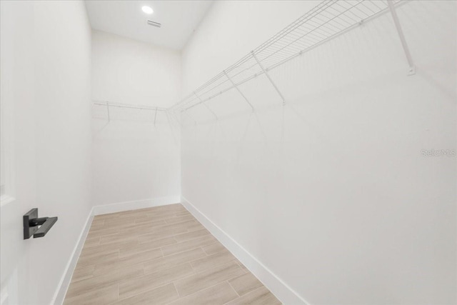 437 Mercedes Ct, Lehigh Acres, FL 33972 - spacious closet featuring light wood-style floors