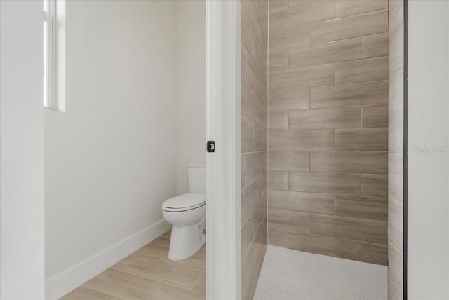 437 Mercedes Ct, Lehigh Acres, FL 33972 - full bathroom with toilet and tiled shower
