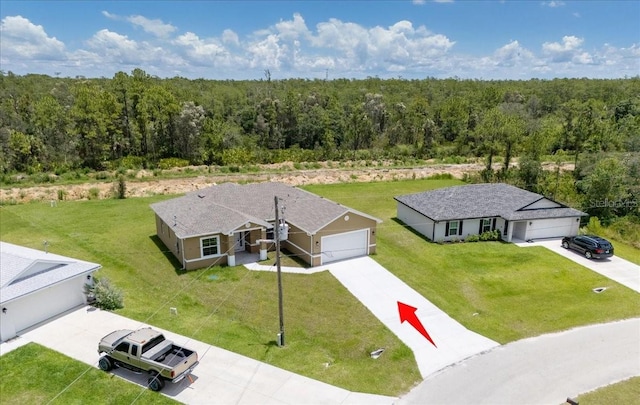 437 Mercedes Ct, Lehigh Acres, FL 33972 - aerial view of property and surrounding area featuring a forest