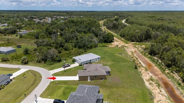 437 Mercedes Ct, Lehigh Acres, FL 33972 - view of property location featuring a forest