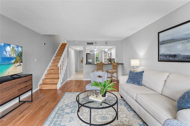 809 Russell Ln Unit 321, Brandon, FL 33510 - living area featuring stairway and wood finished floors
