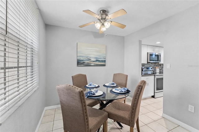 809 Russell Ln Unit 321, Brandon, FL 33510 - dining area with light tile patterned floors and ceiling fan
