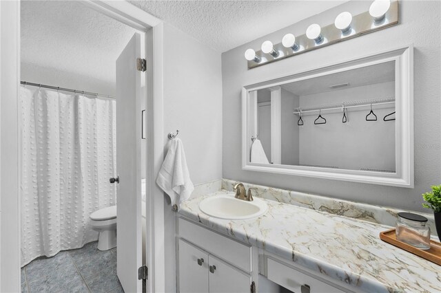 809 Russell Ln Unit 321, Brandon, FL 33510 - full bathroom with vanity, a textured ceiling, and tile patterned flooring