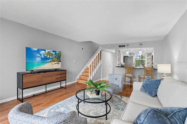809 Russell Ln Unit 321, Brandon, FL 33510 - living room with stairway and wood finished floors