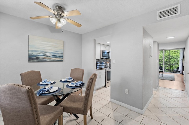 809 Russell Ln Unit 321, Brandon, FL 33510 - dining space featuring light tile patterned floors and ceiling fan