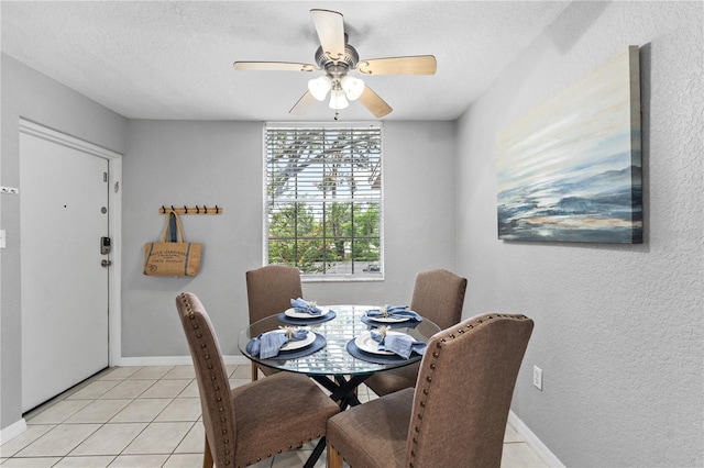 809 Russell Ln Unit 321, Brandon, FL 33510 - dining area featuring a ceiling fan, a textured ceiling, light tile patterned floors, and a textured wall