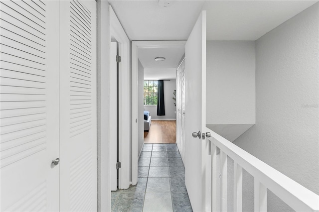 809 Russell Ln Unit 321, Brandon, FL 33510 - hallway featuring tile patterned flooring and a textured wall
