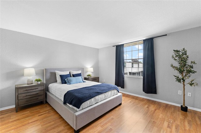 809 Russell Ln Unit 321, Brandon, FL 33510 - bedroom with light wood finished floors and baseboards