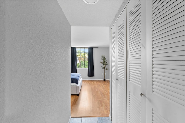 809 Russell Ln Unit 321, Brandon, FL 33510 - hall with a textured wall and wood finished floors