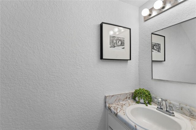 809 Russell Ln Unit 321, Brandon, FL 33510 - bathroom featuring vanity and a textured wall