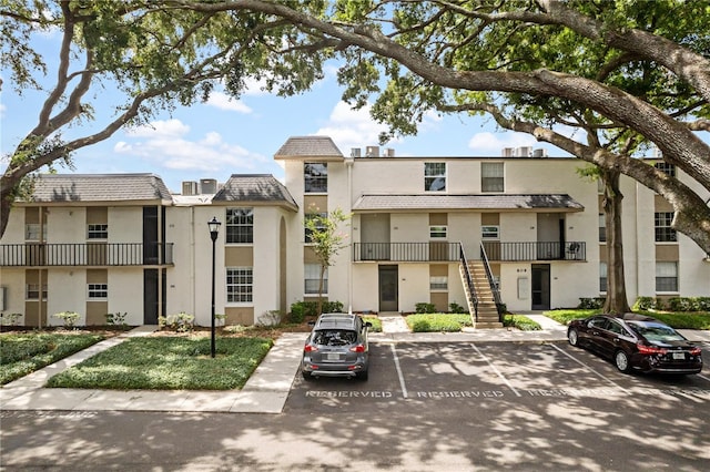 809 Russell Ln Unit 321, Brandon, FL 33510 - view of property with uncovered parking and stairway