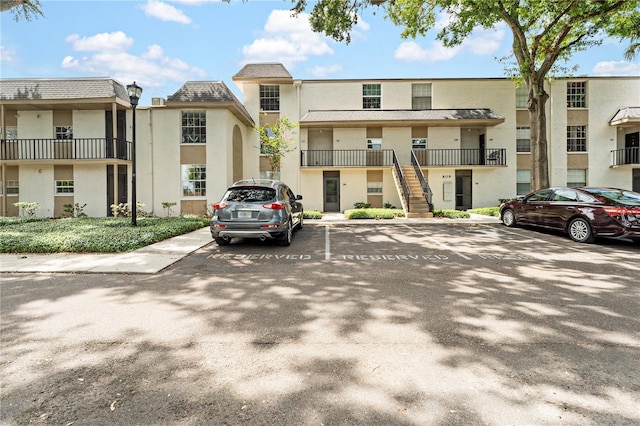 809 Russell Ln Unit 321, Brandon, FL 33510 - view of property with uncovered parking and stairs