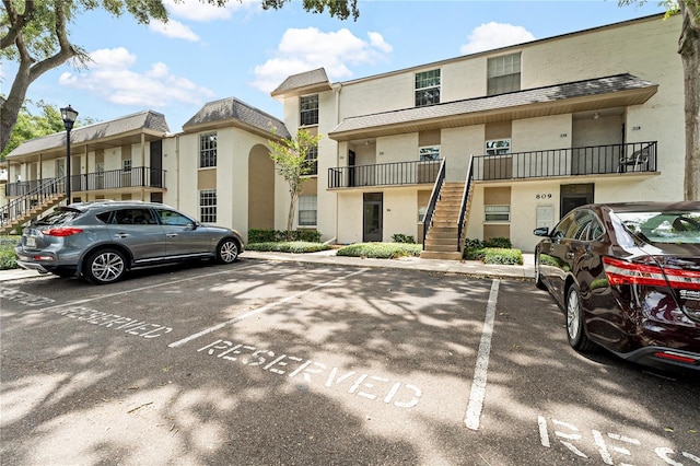 809 Russell Ln Unit 321, Brandon, FL 33510 - view of property featuring stairway and uncovered parking