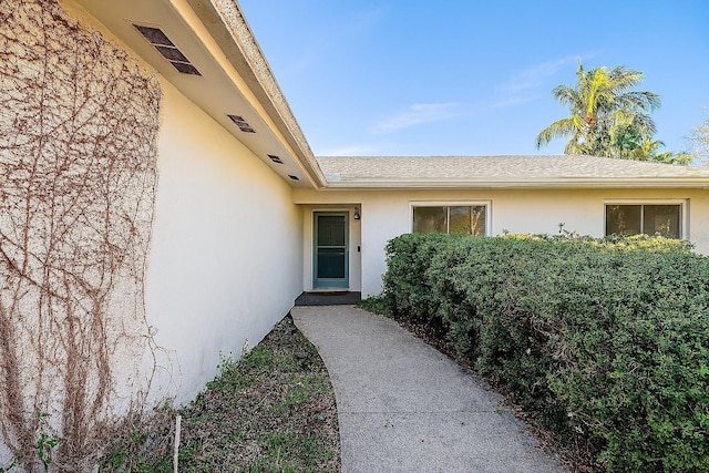 5116 Venetian Blvd NE, Saint Petersburg, FL 33703 - property entrance featuring stucco siding