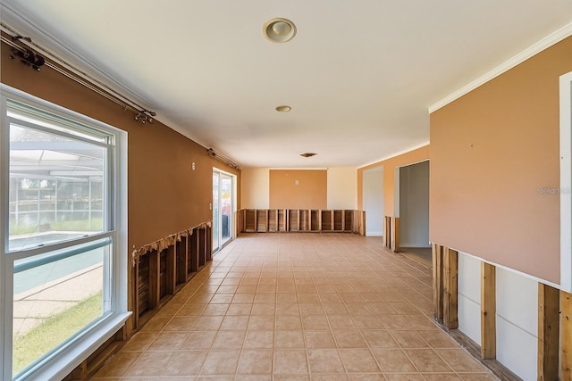 5116 Venetian Blvd NE, Saint Petersburg, FL 33703 - corridor with crown molding and light tile patterned flooring