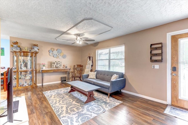 320 Pheasant Cir, Brandon, FL 33510 - living area featuring wood finished floors, a ceiling fan, and a textured ceiling