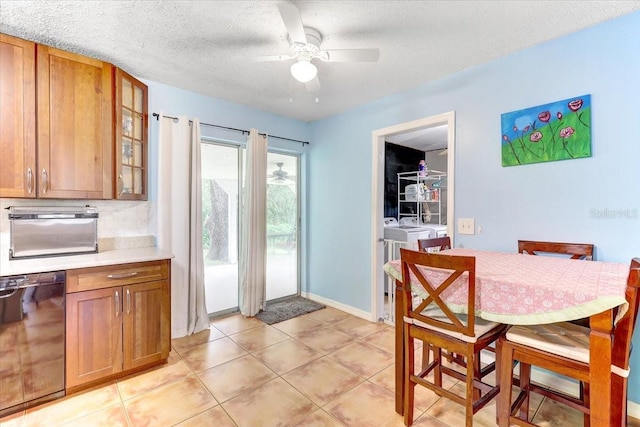 320 Pheasant Cir, Brandon, FL 33510 - dining space with washer and clothes dryer, ceiling fan, a textured ceiling, and light tile patterned flooring