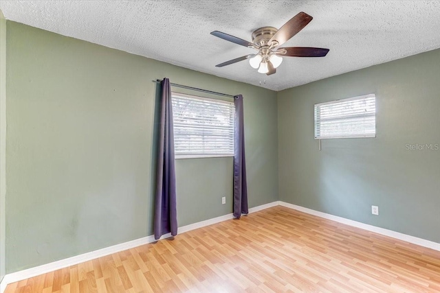 320 Pheasant Cir, Brandon, FL 33510 - spare room with healthy amount of natural light, light wood finished floors, a textured ceiling, and a ceiling fan