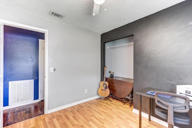 320 Pheasant Cir, Brandon, FL 33510 - office area with wood finished floors, a textured ceiling, and a ceiling fan