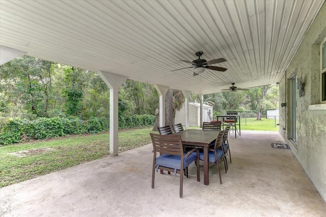 320 Pheasant Cir, Brandon, FL 33510 - view of patio featuring outdoor dining space, a shed, and ceiling fan